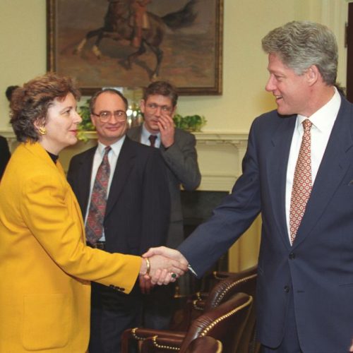 Edith K. Lauer and President Bill Clinton at a discussion about NATO expansion in 1994